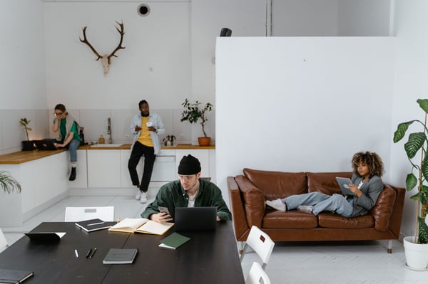 This is an image of people working in a casual co-working space