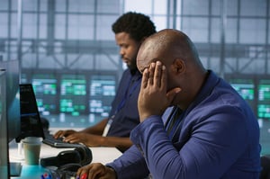 This is an image of a frustrated man in an office.