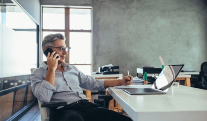Business man on the phone at his desk