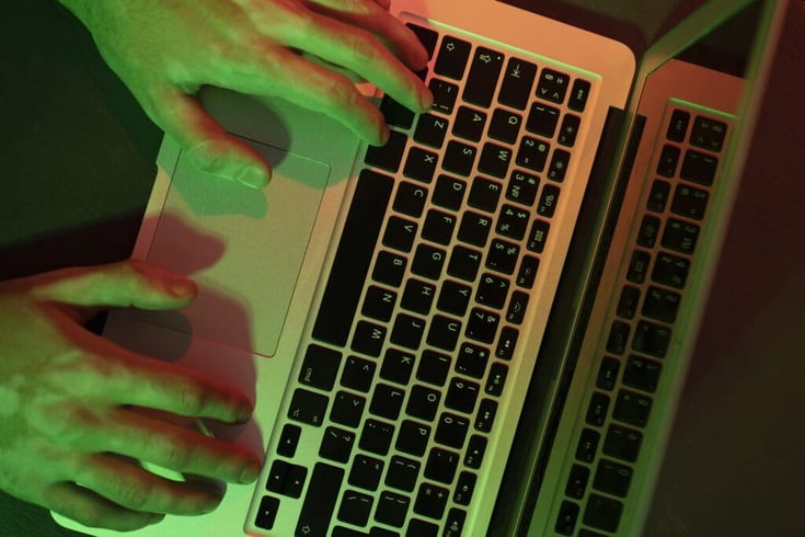 A close up of hands-typing on key-board