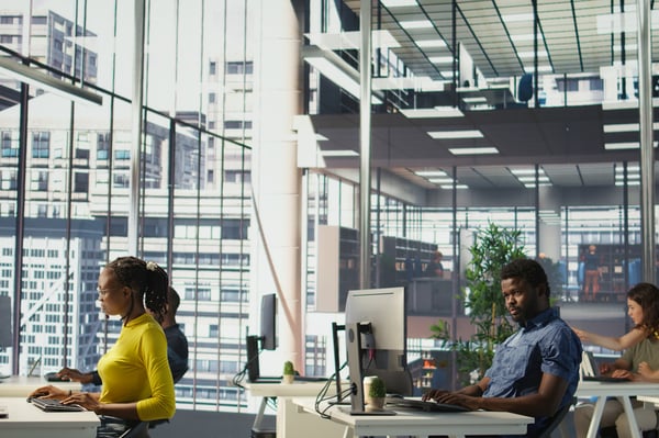 This is an image of people working in a large office.