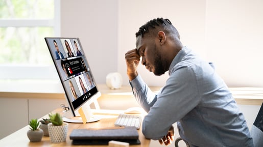 This is an image of a man looking frustrated as he has lost connectivity on his computer.