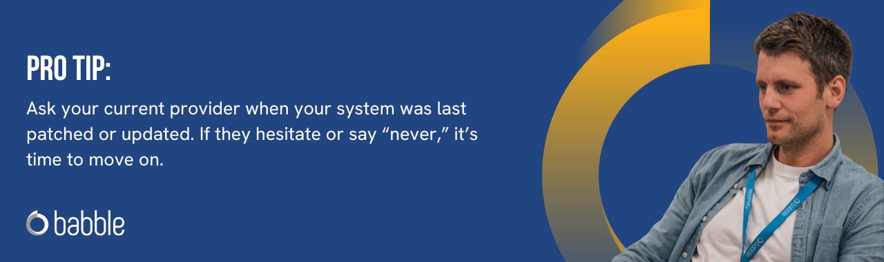 This graphic visually represents a "pro tip" that advises you to ask your current provider when your system was last patched or updated and features an image of a man smiling.
