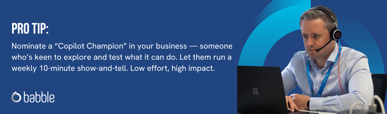 This graphic visually represents a "pro tip" that advises you to nominate a “Copilot Champion” in your business to teach others how to use it and features an image of a man working at a desk.