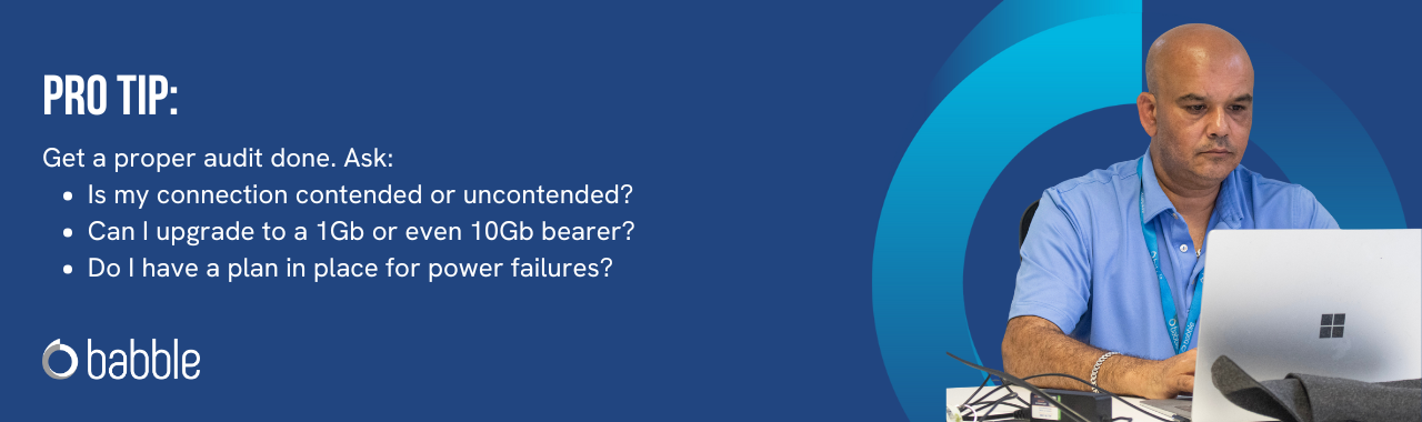 This graphic visually represents a "pro tip" to get a proper telephony & connectivity audit done and features an image of a man working at a desk.