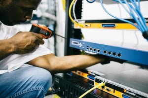 This is an image of a field engineer installing fibre.