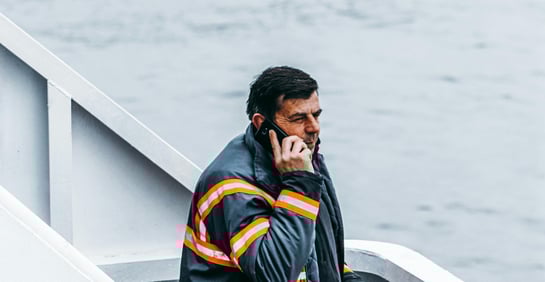 This is an image of a blue-collar worker on the phone.