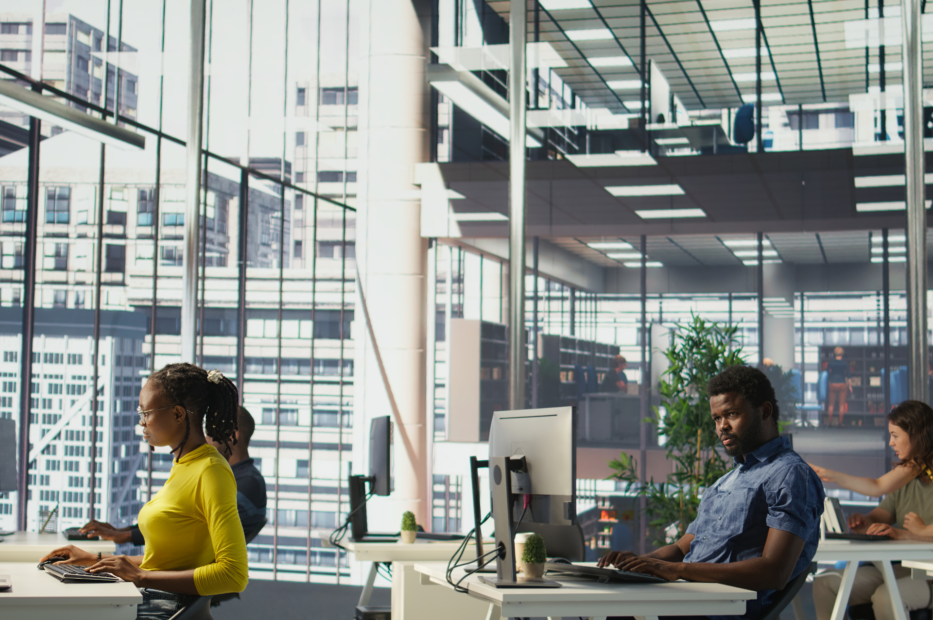 This is an image of people working in a large office.